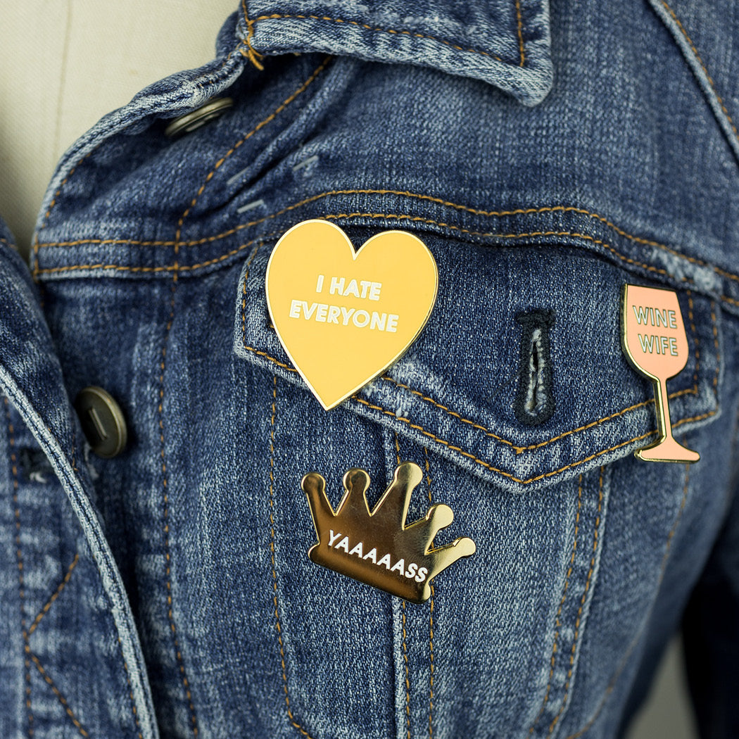 Chez Gagne Yaaaaas Queen Enamel Pin. Say it loud, say it proud - YAAAAAASS! 1.5" Hard Enamel Pin  This hilarious and relatable enamel pin is mounted to a pink and foil patterned Card Backer. The perfect enamel pin for your LGBTQ self or bestie! Ideal for your denim jacket, face mask or backpack! Packaged in Sealed Cello. LGBTQ queen pin. Yaaaaaas queen enamel pin.