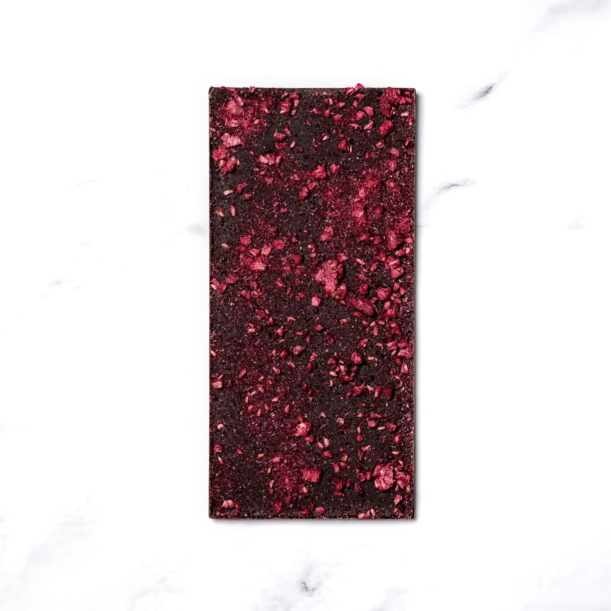 The Aprés Bar 70% Chocolate by Ritual Chocolates. Champagne and Raspberry Infused Dark Chocolate. Single Origin Chocolate. Organic Dark Chocolate. Bean to Bar Chocolate